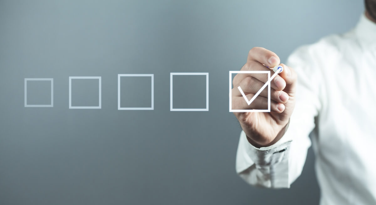 Small business due diligence checklist: person checking a checkbox