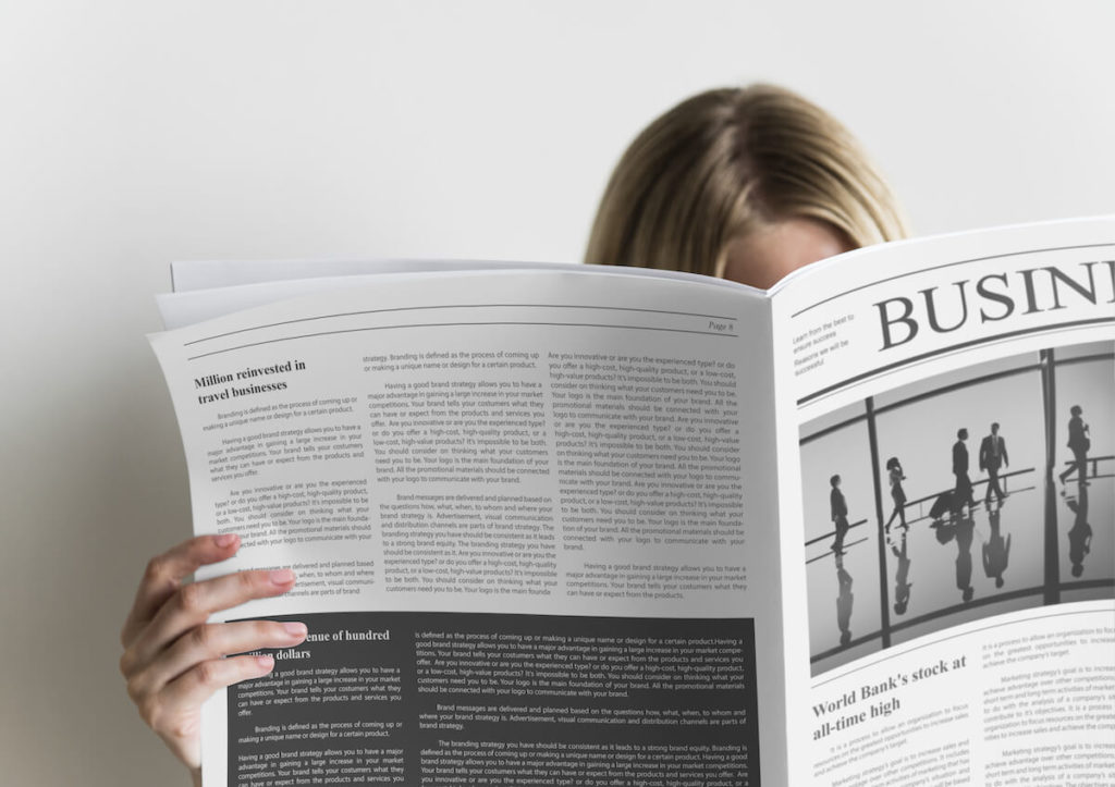 Small business valuation multiples: person reading a newspaper